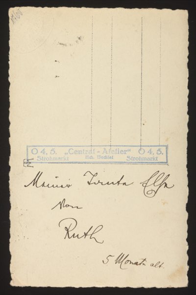 ANNOTATION ON PHOTO (back, handwritten): Studio stamp: "O 4, 5. 'Central-Atelier' Hch. Bechtel, O 4, 5. Strohmarkt" (Studio located at O 4, 5 Strohmarkt, Mannheim) Handwritten text: "Marias Truda Elsa von Ruth 5 Monate alt." English: "Maria's [child?] Truda Elsa from Ruth 5 months old." Note: The names Truda, Elsa, and Ruth appear. "5 Monate alt" means 5 months old. The studio was located in Mannheim (O 4, 5 is a Mannheim address grid reference on the Strohmarkt). Description: Front shows a baby lying on a fur rug on a small bench/table, approximately 5 months old.