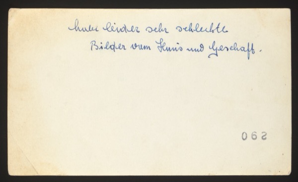 ANNOTATION ON PHOTO (back, handwritten): German: "huber leider sehr schlechte Bilder vom Haus und Geschäft." English: "unfortunately very poor photos of the house and business." Number: "062" at bottom Description: Front shows an American street scene with "Langenbein's Bakery" and "Paint Supply" shop signs. Several people standing in front. Appears to be the family's American business. The annotation suggests these were sent to Germany to show relatives the family's shop.