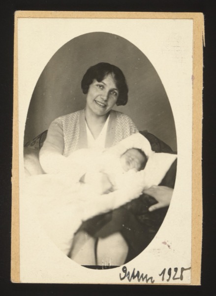 ANNOTATION ON PHOTO (front, bottom, handwritten): German: "Ostern 1925" English: "Easter 1925" Description: Oval-framed portrait of a smiling young mother holding a newborn baby wrapped in white blankets. Taken at Easter 1925.