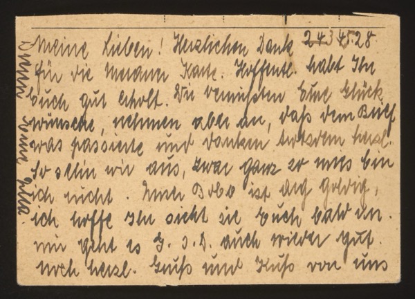 POSTCARD (back, handwritten message dated 24.5.28) German (partially legible): "Meine Lieben! Herzlichen Dank 24.5.28. für die [warme?] Karte. Hoffentl[ich] habt Ihr euch gut erholt. Wir wünschen [Euch] Glück- wünsche, nehmen aber an, daß dem Brief was passierte und [?] haben [?]. So sehen wir aus, zwar ganz so [schlimm?] bin ich nicht. Auch Dodo ist auf [?], ich hoffe [?] nicht sie euch bald [zu sehen?]. mir geht es G.s.D. auch wieder gut. noch herzl. Gruß und Kuß von uns" Translation (approximate): "My dears! Many thanks, 24 May 1928. for the [warm?] card. Hopefully you have recovered well. We wish you good wishes, but assume that something happened to the letter and [?] had [?]. This is how we look, though I'm not quite as [bad?] as that. Dodo is also [well?], I hope [?] not to see you soon. I am, thank God, also well again. warm greetings and kisses from us" Note: The writer mentions someone named "Dodo" and refers to "G.s.D." (Gott sei Dank / Thank God). The postcard accompanies a photograph (front side likely shows the writer/family). Written on the left margin is additional text, partially illegible.