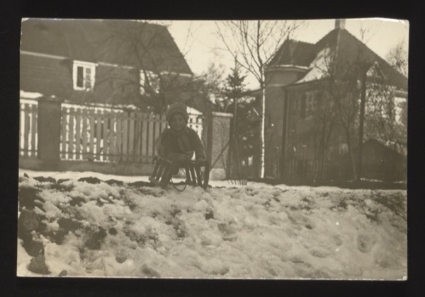 The front likely shows a child (Norbert) cycling. Photographed in Basel, Switzerland, 1925. Same Norbert as in group 003 photo 0009.