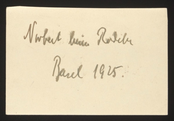 ANNOTATION ON PHOTO (back, handwritten): German: "Norbert beim Radeln Basel 1925." English: "Norbert cycling Basel 1925." Description: The front likely shows a child (Norbert) cycling. Photographed in Basel, Switzerland, 1925. Same Norbert as in group 003 photo 0009.