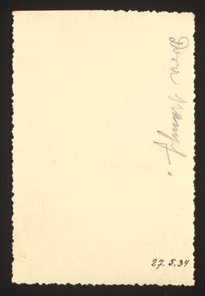 ANNOTATION ON PHOTO (back, handwritten): Name (written vertically): "Irmi Strunpf" [partially legible] Date: "27. 5. 34" (27 May 1934) Description: Identifies a person named Irmi in the photograph, dated 27 May 1934.