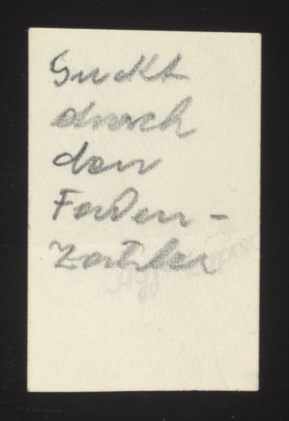 ANNOTATION ON PHOTO (back, handwritten): German: "Guckt durch den Faden- zähler" English: "Looking through the thread counter" Description: A humorous caption describing someone peering through a thread counter (a small magnifying device used in textile work). The front likely shows someone looking through the device.