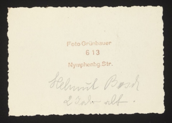 ANNOTATION ON PHOTO (back, printed and handwritten): Printed studio stamp: "Foto Grünbauer 613 Nymphenbg. Str." (Foto Grünbauer, 613 Nymphenburger Straße, Munich) Handwritten: "Helmut Bosch. 2 Jahre alt." English: "Helmut Bosch. 2 years old." Description: Portrait of a boy (Helmut Bosch) at age 2. The studio was on Nymphenburger Straße in Munich.